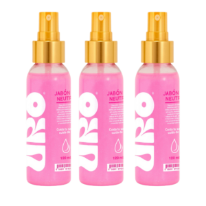 Tres envases de jabón íntimo Uro spray de 120 ml, color rosa con atomizador dorado, alineados de frente.